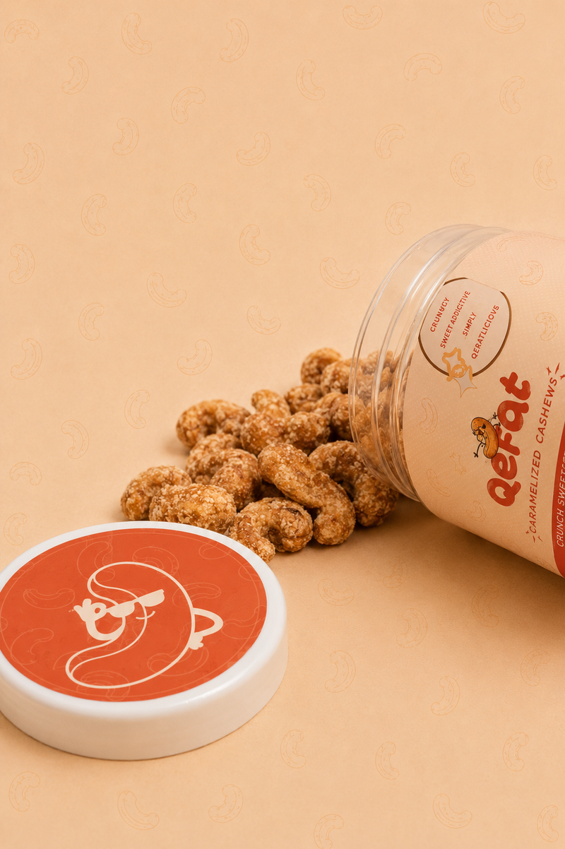 QERAT caramelized cashews spilling out of tipped jar showing texture