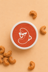 Top view of QERAT caramelized cashews jar red lid with logo