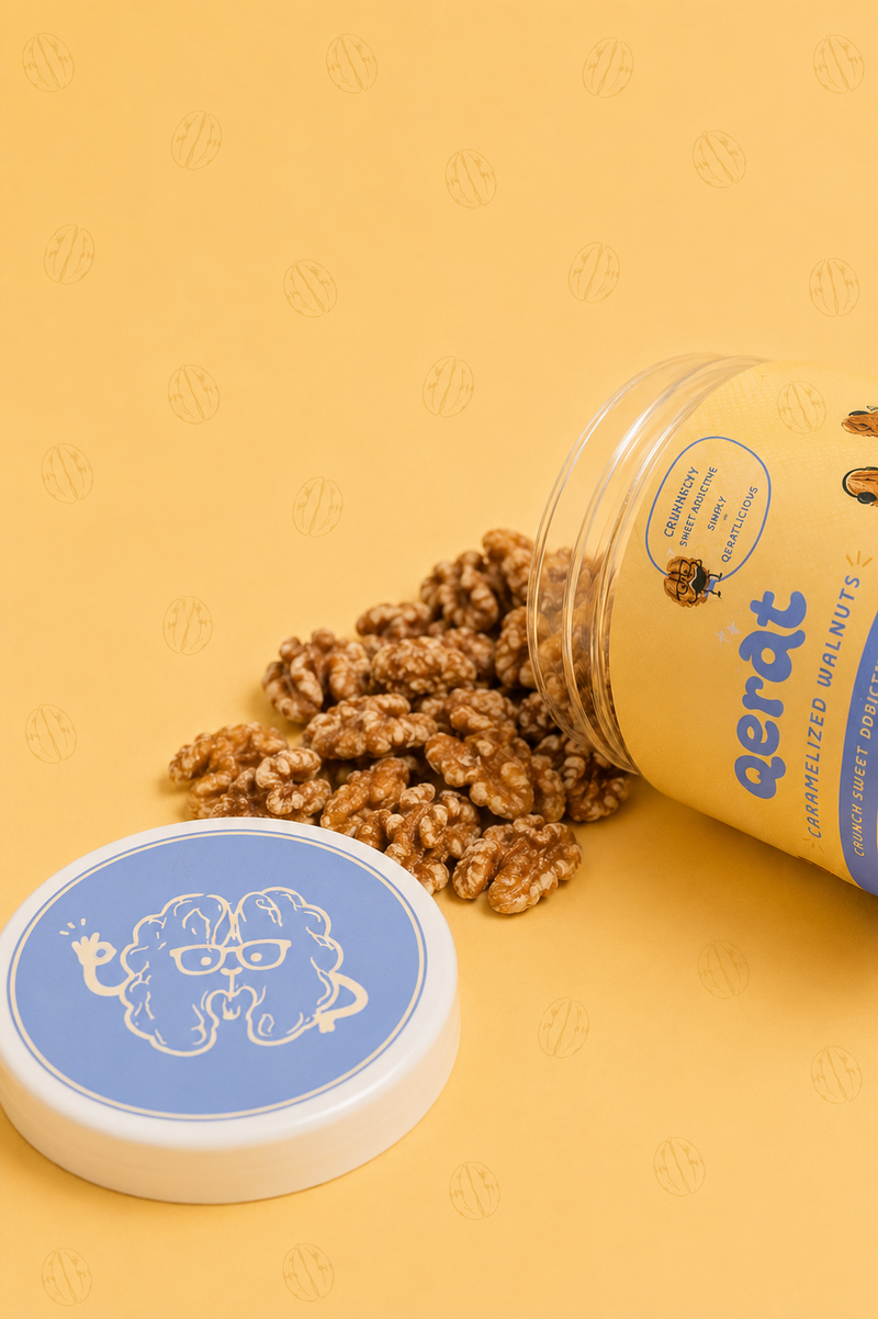 QERAT caramelized walnuts spilling out of tipped jar showing texture