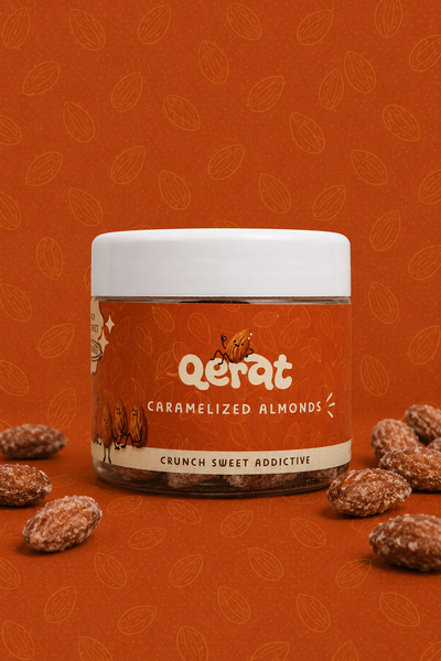 QERAT caramelized almonds jar with orange label on rust orange background with scattered almonds